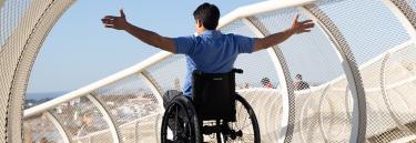 Manual wheelchair Küschall Champion 2.0 black frame man on the bridge
